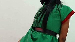 Celebrating christmas in christmas suit taking off clothes dancing sexy on desk