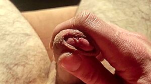 edging from soft to hard, playing with precum in natural light.