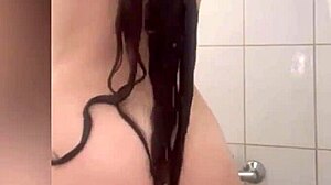 Hot water is used to wash the body in a solo action - amateur