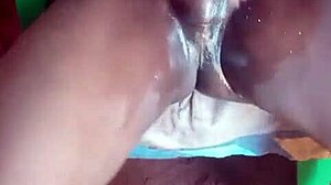 A big black dick with oil lubricates and cum in a rather unusual position