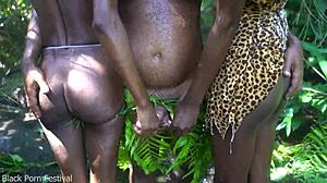 Two African tribe girls having fun with the chief