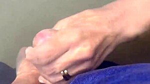 Milf gives handjob on beach with big tits exposed. Public outdoor cum from monster cock?